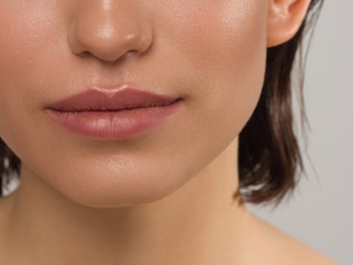 Closeup plump Lips. Lip Care, Augmentation, Fillers. Macro photo with Face detail. Natural shape with perfect contour. Close-up perfect natural lip makeup beautiful female mouth. Plump sexy full lips