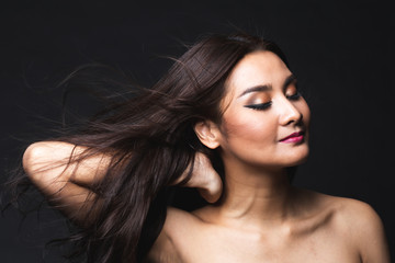 Fototapeta premium Portrait of young asian woman with makeup long hair.