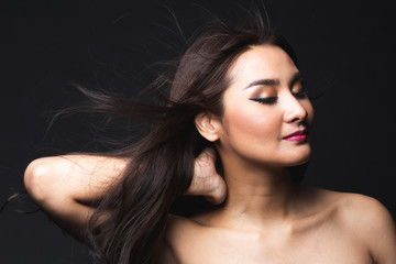 Fototapeta premium Portrait of young asian woman with makeup long hair.