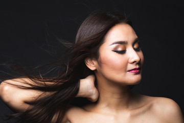 Fototapeta premium Portrait of young asian woman with makeup long hair.