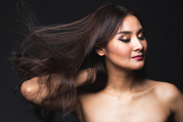 Portrait of young asian woman with makeup long hair.