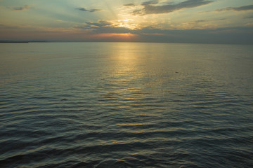 Caspian Sea. Azerbaijan Baku Beautiful sunset in yellow as background. Azerbaijan nature . The sunset, the sea and the clouds.