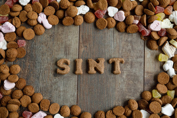 Dutch candy called Pepernoten eaten during Sinterklaas feast. The candy is arranged in the Dutch word Santa which is a short name for Santa Claus