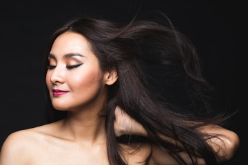 Portrait of young asian woman with makeup long hair.