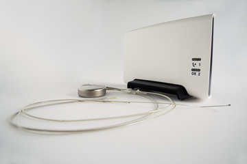 An Implantable Cardioverter Defibrillator or ICD pacemaker with leads and modem for telemonitoring at home. The device sends data to the hospital on a regular basis.