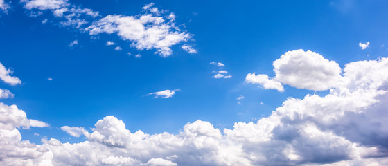 Beautiful blue summer sky with clouds as a background