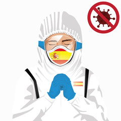 Covid-19 or Coronavirus concept. Spanish medical staff wearing mask in protective clothing and praying for against Covid-19 virus outbreak in Spain. Spanish man and Spain flag. Epidemic corona virus