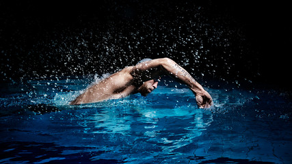 Man crawls. Water sports concept. - obrazy, fototapety, plakaty