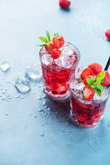 Red cocktail with ice and mint