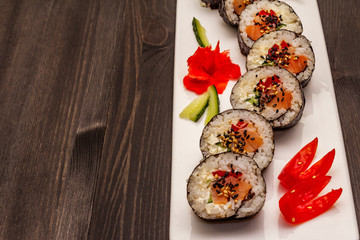 Korean roll Gimbap(kimbob). Steamed white rice (bap) and various other ingredients. Trendy black background