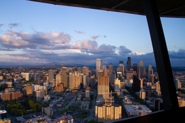 Fototapeta na wymiar Arial view of Seattle waterway from the Space Needle just before sunset with dark clouds moving in against a blue sky Royalty free stock photo