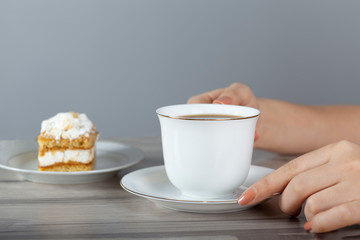 woman eat cake and drink coffee