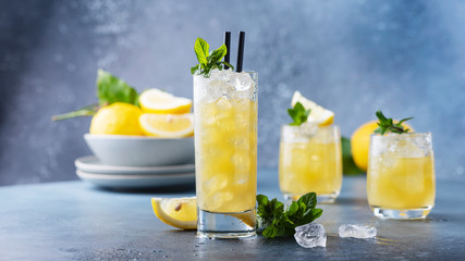 Fresh summer cocktail with lemons