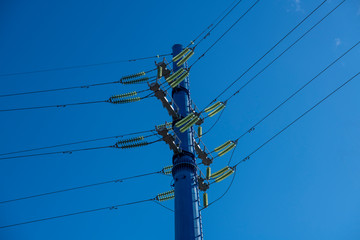 blue truss electric high voltage lines on a blue background