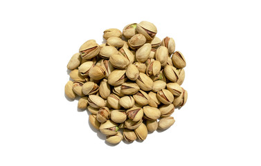 Pistachio nuts isolated on white background. Healthy snack and food. Salted pistachios heap. Top view. 