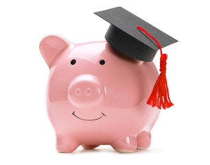 Piggy bank and black graduate hat isolated on white background