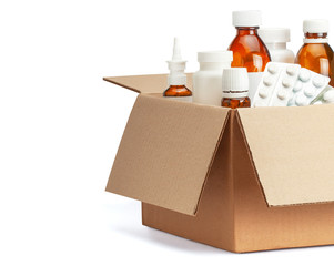 Delivery of medicines home from the pharmacy. Cardboard box with medicines, pills, bottles, sprays....
