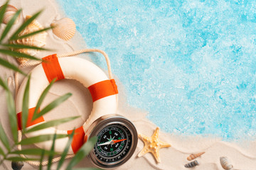 vacation and travel concept, Flat lay top view copy space, exotic concept. Creative layout of sand waves and sea, summer beach background with shell, sea star, compass life preserver and blurred Palm