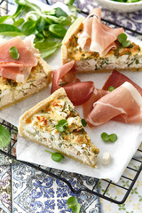 Homemade Cheesy Egg Quiche for Brunch with Spinach and jamon.