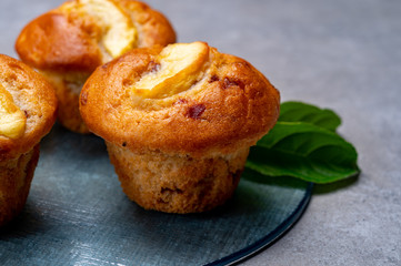 Fresh baked muffins with apple and cinnamon close up