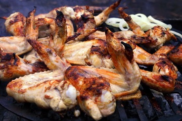 marinated chicken wings grilled, macro. soft focus
