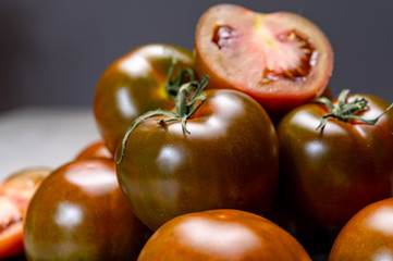 Fresh ripe sweet reddish brown and green kumato tomatoes