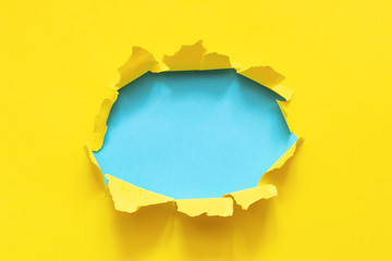 Hole of torn yellow paper