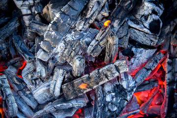 Burning coals close-up in a barbecue. Preparation for frying meat