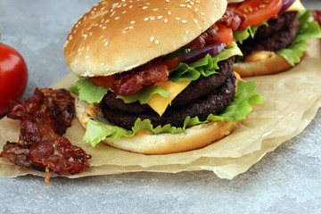 Tasty fresh meat burgers with salad and cheese. Homemade angus burger.
