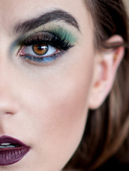 Portrait of beautiful young lady with amazing makeup, close up
