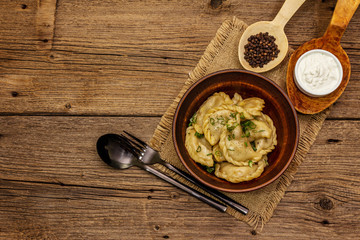 Dumplings stuffed stewed cabbage and sour cream. Traditional Ukrainian dish varenyky