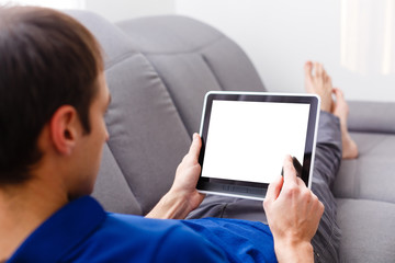 Business man holding and shows touch screen tablet pc with blank screen.