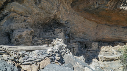 Ancient Abandoned Stone Cliff Houses in Wadi Ghul aka Grand Canyon of Oman in Jebel Shams Mountains