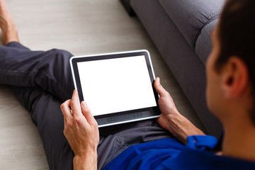 Business man holding and shows touch screen tablet pc with blank screen.
