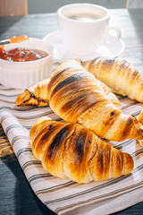 croissants with jam and coffee