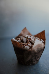 delicious chocolate muffins on dark background, selective focus