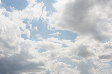 Obraz premium white clouds on a blue sky before a thunderstorm