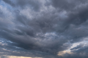 Naklejka na ściany i meble Grey clouds, overcast weather, the approaching thunderstorm