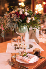 Table set for a wedding reception. Flower table decorations for wedding party. Wedding Setup.