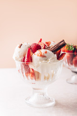 Vanilla Ice Cream Scoops with strawberry pieces, easy dessert at home