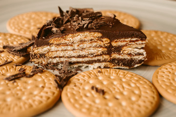 Delicious biscuit and chocolate cake. Homemade cake on biscuit background.  