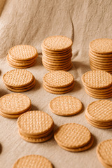 Stack of cereal biscuits as background. 