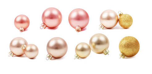 Modern set of glass monochromatic Christmas toys. Christmas decorations, round shapes. New Year's glass balls. Pearl, pink and gold colors. Stock photo, isolated on white, side view