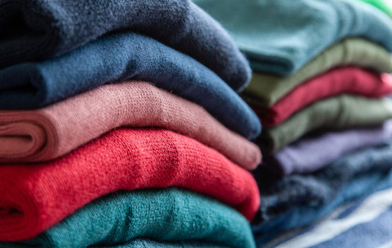 Pile of woollen jumpers