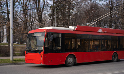 Fototapeta na wymiar Tralleybus rides on the city road