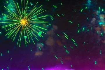 Holiday fireworks with sparks on dark sky as star, comet in universe. Festive background