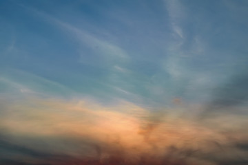 The sky at sunset. Cumulus clouds lit by the rays of the setting sun.