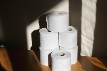 Stack of toilet paper, made with recycled paper. Selective focus.