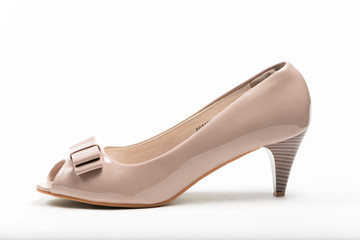 Beige female shoes on a white background