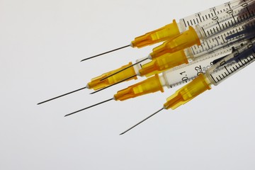 Assortment of syringes used in healthcare and illegal drug usage